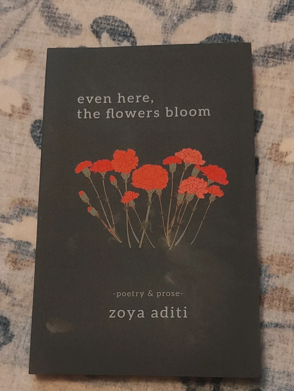 POEMS: EVEN HERE, THE FLOWERS BLOOM